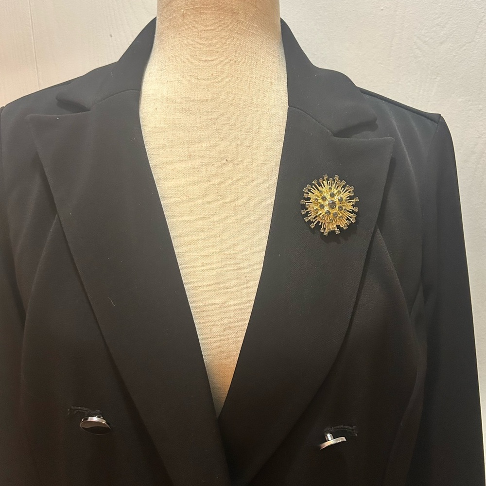 Radiant Gold and green Rhinestone Starburst Brooch
